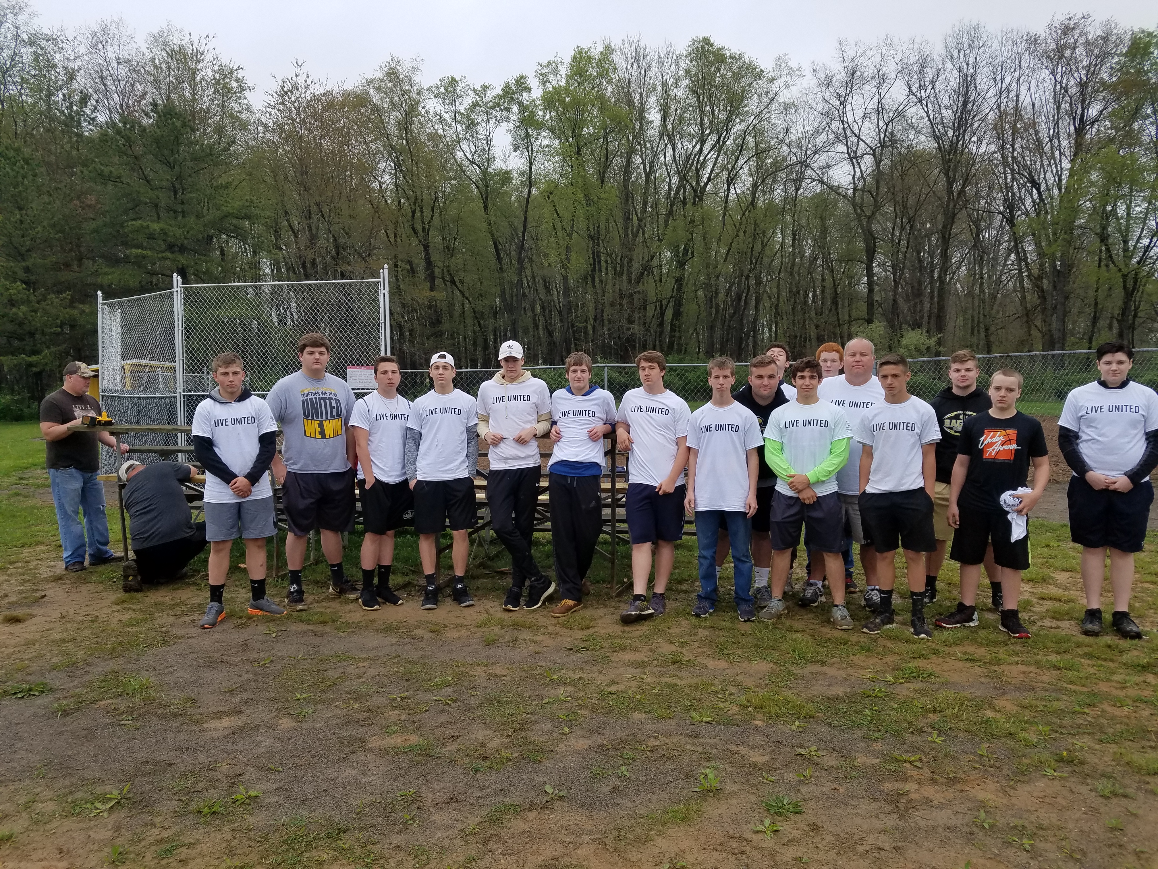 The GCHS Football Team prepared the softball fields for the season